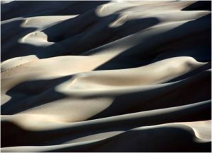 Sand ripples in low sun and no wind, but can shift and blind you, drown you unexpectedly. Watch out! 
